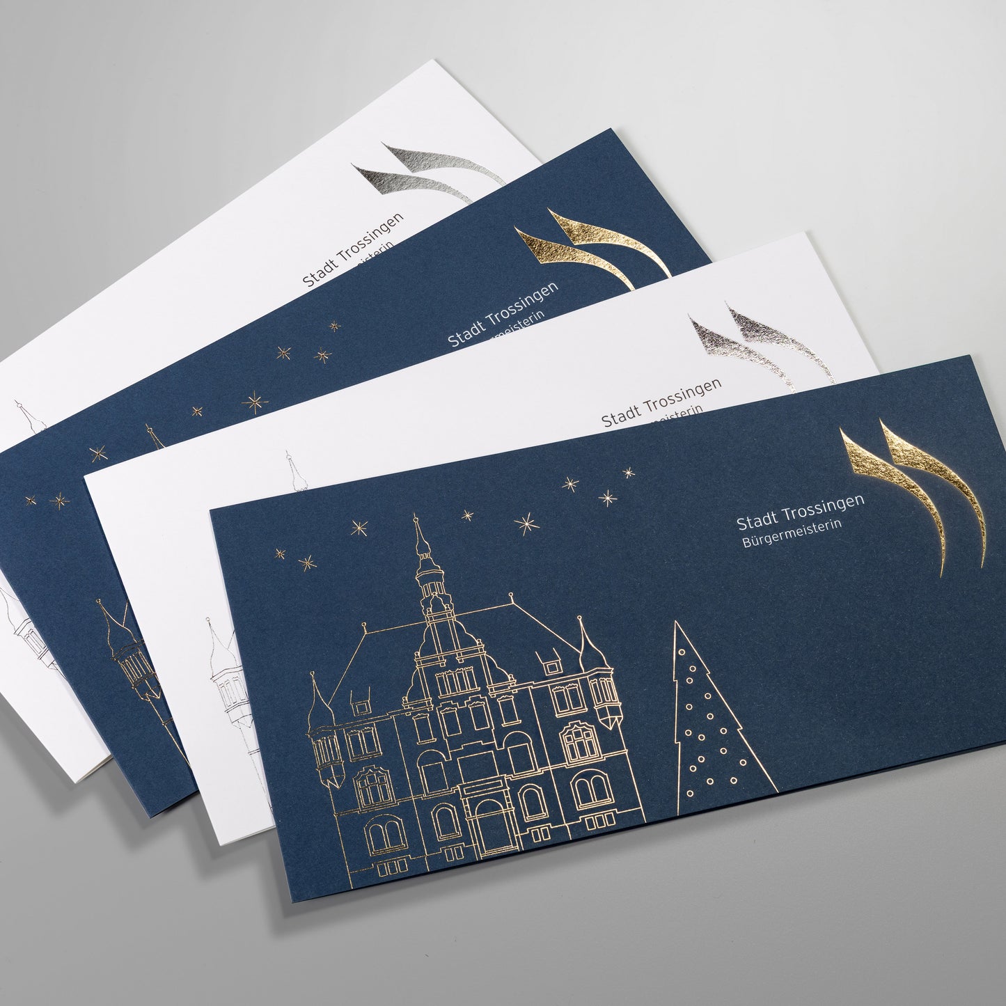 Foliengeprägte Weihnachtskarten, Heissfolienprägung, goldener, glänzender Druck auf weissem und blauen Colorplan Karton.