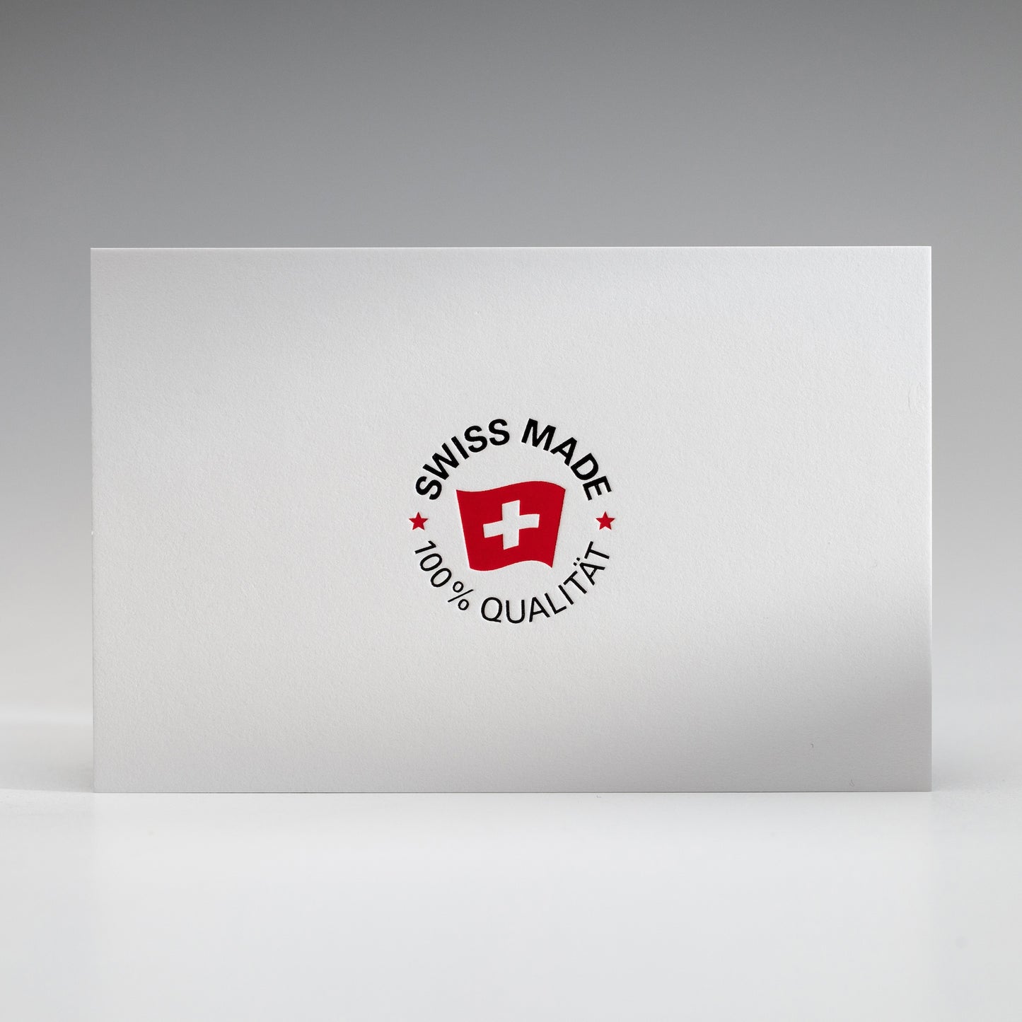 Visitenkarte mit Heißfolienprägung: Beispiel SWISS MADE